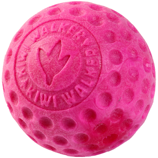 Pink textured rubber ball dog toy with raised dots and a heart logo on the surface.