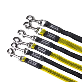 Six dog leashes with metal snap hooks, black and yellow woven straps, laid diagonally across white background with Genuine DogSport branding on the handles.